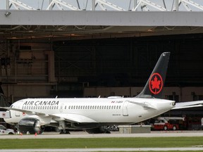 An Air Canada jet at a maintenance hangar at Trudeau airport in Montreal on Saturday May 16, 2020.