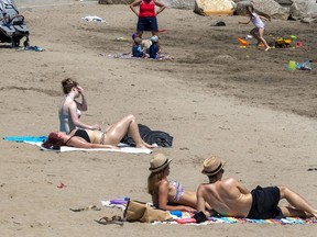People maintain social distancing at the Verdun Beach on Tuesday, May 26, 2020.