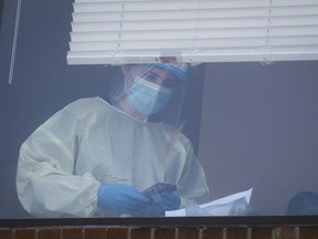 A medical worker tends to patients at the CHSLD Vigi Mont Royal on Tuesday May 26, 2020.