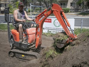Shawn Manning prepares lot for the new community initiative called Solidarity Gardens at Gouin Park on Wednesday.