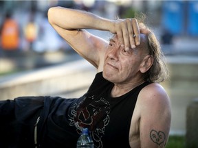 Ronald Blass is among those who come to Place Émilie-Gamelin for meals. There are measures in place to ensure social distancing, but the services have drawn large crowds.