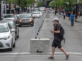 Parts of Ste-Catherine St. W. were blocked off to cars in Montreal on Friday May 29, 2020. The majority of pedestrians used the sidewalks.