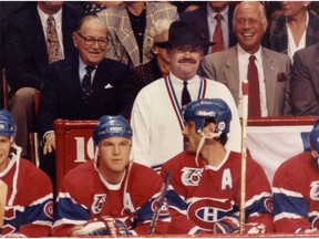 Canadiens coach Pat Burns wears a fedora behind the bench during game at the Montreal Forum in 1991.