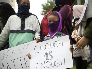 Young protesters during an anti-racist and anti-police brutality demonstration on Sunday, May 31, 2020, in Montreal.