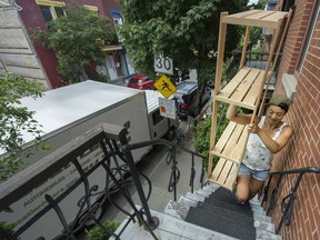 Regine Tshimbalanga helps friends move into their new apartment in Montreal during Quebec's traditional moving day Friday, July 1, 2016. (Peter McCabe / MONTREAL GAZETTE)