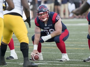 Alouettes' Luc Brodeur-Jourdain prepares to snap the ball for one of the last times during Canadian Football League game against the Hamilton Tiger-Cats in Montreal on July 4, 2019.