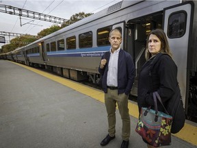Francis Millaire left, and Karolyne Viau post for photo at the Deux Montagnes train station, north of Montreal, on Oct. 10, 2019.