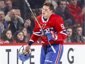 Canadiens' Noah Juulsen heads to the bench after taking a puck to the face against the Washington Capitals in Montreal on Nov. 19, 2018.