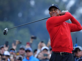 Tiger Woods plays his shot from the 18th tee during the final round of the Farmers Insurance Open at Torrey Pines South on Jan. 26, 2020, in San Diego.