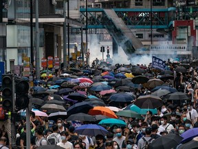 Police fire tear gas to disperse protesters during an anti-government rally on May 24, 2020 in Hong Kong, China.