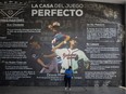 A cleaner mops the floor during a baseball game of Nicaragua's National League between Cafeteros del Carazo and Leones de León at Estadio Nacional Dennis Martinez on April 7, 2020, in Managua, Nicaragua. Sport activities continue in Nicaragua despite the international alert on the spread of the COVID-19.