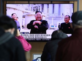 People watch a television broadcast reporting an image of North Korean leader Kim Jong-un during a news program on May 02, 2020 in Seoul, South Korea. North Korean leader Kim Jong-un attended a fertilizer factory completion ceremony, state media reported Saturday, his first public appearance after 20 days of absence that sparked rumors about his health.