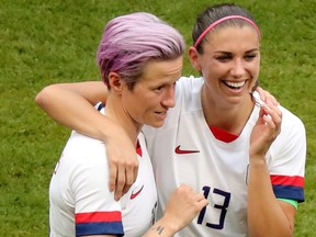 Megan Rapinoe, left, of the U.S. celebrates winning the Women's World Cup with Alex Morgan at the Women's World Cup Final in Lyon, France, July 7, 2019.