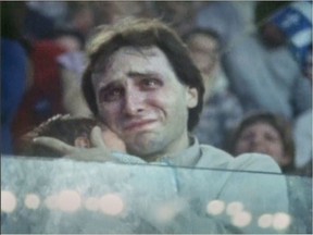 Yes supporter Laurent Leclerc, with baby Benjamin in his arms, listens to Premier René Lévesque concede defeat at the Paul Sauvé Arena after the 1980 Quebec referendum.