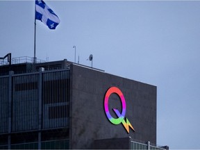 The Hydro-Québec logo lit up in Ça va bien aller rainbow colours.