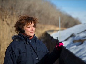 Lisa Mintz, an activist with Sauvons la falaise, poses for a photograph at the Falaise Saint-Jacques escarpment that sits adjacent to the Turcot Yards in Montreal on Jan. 11, 2016.