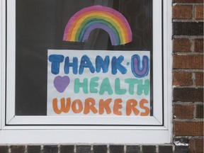 A sign in a window in N.D.G. says thank you to health-care workers.