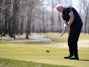 General manager Mike Paquin tests the greens at Windmill Heights Golf Club this week.