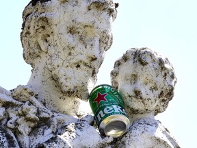 A vacant convent in Pointe-Claire Village was hit by vandals who scrawled obscenities, broke windows and screens, and jammed a beer can onto this nearby statue.
