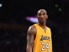 In this file photo taken on Nov. 21, 2015, Kobe Bryant of the Los Angeles Lakers looks on during the Lakers NBA match up with the Toronto Raptors at Staples Center in Los Angeles.