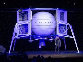 In this file photo Amazon CEO Jeff Bezos announces Blue Moon, a lunar landing vehicle for the moon, during a Blue Origin event in Washington, D.C., on May 9, 2019. NASA on April 30, 2020, awarded almost $1 billion in contracts to three space companies, including those owned by Elon Musk and Jeff Bezos, to develop lunar landers as the United States seeks to return human beings to the moon.
