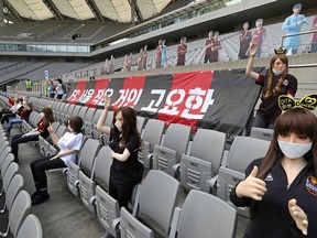 TOPSHOT - In a photo taken on May 17, 2020 mannequins are displayed at a FC Seoul football match in Seoul. - South Korean football club FC Seoul apologised May 18, 2020 after reports that it had used sex dolls to fill up its empty stands during a game at the weekend. (Photo by - / YONHAP / AFP) / - South Korea OUT / REPUBLIC OF KOREA OUT  NO ARCHIVES  RESTRICTED TO SUBSCRIPTION USE