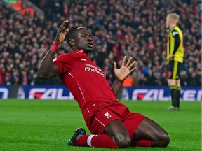 In this file photo taken on February 27, 2019 Liverpool's Senegalese striker Sadio Mane celebrates after scoring the opening goal of the English Premier League football match between Liverpool and Watford at Anfield in Liverpool - Premier League clubs will return to training in small groups from Tuesday after the latest stage of "Project Restart" was approved on Monday, May 18. (Photo by Anthony DEVLIN / AFP)