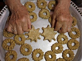 A Palestinian woman in Gaza makes traditional sweets in the shape of coronavirus on May 19, 2020 in preparation for the Eid-ul-Fitr holiday, which marks the end of the Muslim holy month of Ramadan.