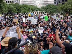 Thousands gather to protest and mourn George Floyd, a black man who died after a white policeman kneeled on his neck for several minutes during the "Justice 4 George Floyd" event in Houston, Tex., on Friday, May 29, 2020.  Demonstrations are being held across the U.S. after Floyd died in police custody on May 25.