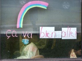 A worker looks out the window at the Vigi Mount Royal seniors' residence on May 1.