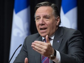 Quebec Premier Francois Legault responds to reporters during a news conference on the COVID-19 pandemic, Monday, May 11, 2020 at the legislature in Quebec City.