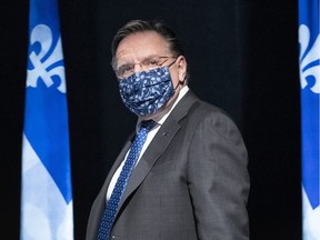 Quebec Premier François Legault arrives at a news conference in Montreal on Friday, May 15, 2020.