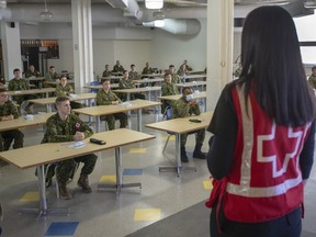 Members of the Canadian Armed Forces take part in a training session before deploying to senior's residences Wednesday April 29, 2020 in Montreal. The Canadian Armed Forces says 28 military members have tested positive for COVID-19 after being deployed to help with long-term care facilities in Ontario and Quebec.