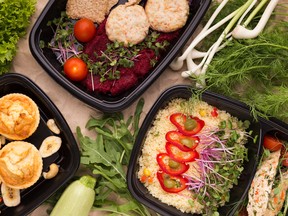Different types of takeaway food in microwavable containers