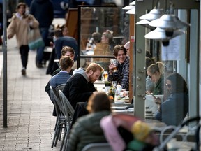 People enjoy themselves at an outdoor restaurant, amid the coronavirus disease (COVID-19) outbreak, in Stockholm, Sweden April 20, 2020.