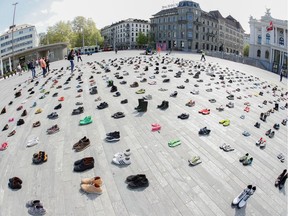 Demonstrating against climate change in times of social distancing: A picture taken with a fisheye lens shows shoes placed in place of live participants by environmental activists of Swiss Klimastreik Schweiz movement to demonstrate against climate change, as the spread of the coronavirus disease (COVID-19) continues, on the Sechselaeutenplatz square in Zurich, Switzerland April 24, 2020.