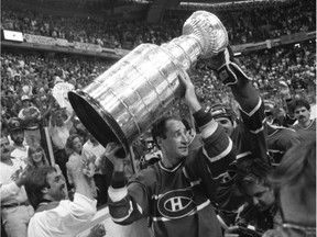 Montreal Canadiens captain Bob Gainey hoists the Stanley Cup after the team's 4-3 Game 5 win over the Flames in Calgary, on May 24, 1986.