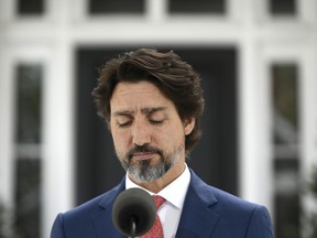 Prime Minister Justin Trudeau pauses during his daily news conference on the COVID-19 pandemic outside his residence at Rideau Cottage in Ottawa, on Tuesday, May 19, 2020.