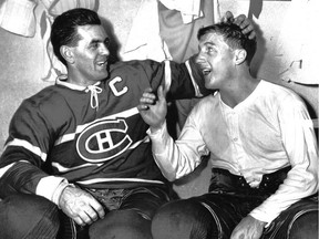 Maurice Richard, left, and Dickie Moore joke around in the dressing room on Jan. 21, 1957, after game in which they scored three of five goals against the New York Rangers.