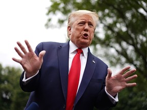 U.S. President Donald Trump speaks to the press as he departs the White House in Washington, D.C., on May 21, 2020.