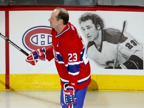 Canadiens Hall of Famer Bob Gainey skates past a portrait of himself during a ceremony to retire his No. 23 sweater during a ceremony at the Bell Centre in Montreal on Feb. 23, 2008.