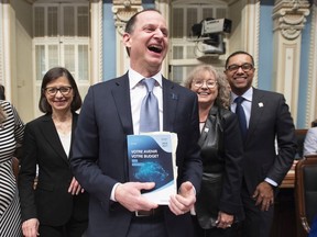 Finance Minister Eric Girard was all smiles when he tabled his budget in March before the coronavirus pandemic hit.