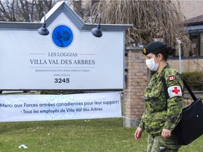 A Canadian Armed Forces member leaves Villa Val des Arbres, a Laval long-term seniors residence, after meeting with staff there with other military members in Laval near Montreal Sunday, April 19,2020.