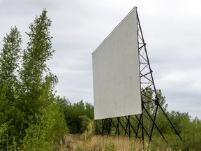 The screen from the old Cine-Parc Vaudreuil still stands in an overgrown field in Vaudreuil-Dorion, west of Montreal Monday May 25, 2020.  Vaudreuil plans to operate a drive-in theatre in the parking lot of Cité-des-Jeunes high school. (John Mahoney / MONTREAL GAZETTE) ORG XMIT: 64469 - 8778