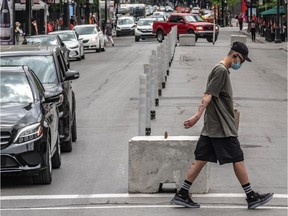 Parts of Sainte-Catherine Street West has been blocked off to cars in Montreal on Friday May 29, 2020. The majority of Montrealers used the sidewalks. Dave Sidaway / Montreal Gazette ORG XMIT: 64340