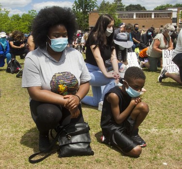 Courtney Connor and son Jaheim at an event called Montreal Kneels for Change at Loyola park in Montreal Sunday, June 7, 2020.