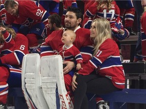 Canadiens goalie Carey Price poses with his wife, Angela, and daughter, Liv Anniston, during team photo day at the Bell Centre on March 27, 2017.