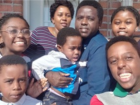 Amoti Furaha Lusi and Désiré Buna Ivara with their five children in happier times. Furaha Lusi, top, wearing stripes, was working as a patient attendant at a nursing home and brought home COVID-19. Her entire family fell ill and her husband died on May 20. Her union has launched a GoFundMe campaign to help.