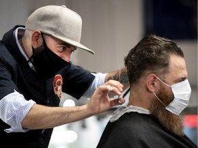 Demo Pedulla cuts Ari Magden's hair as Bloke — Barber and Shop reopened on Monday, June 15, 2020.