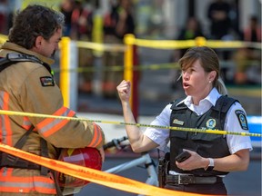 Police and firefighters pack up after a bomb scare at the U.S. consulate in Montreal June 18, 2020.